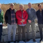 Group of men celebrating a Transportation Alternatives Grant for new park signage and access improvements, including Michael Stubbs