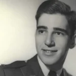 Sepia photograph of a young man in military attire
