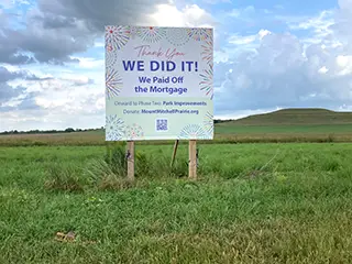 Mortgage payoff sign Sign in the ground reading We did it! We paid off the mortgage
